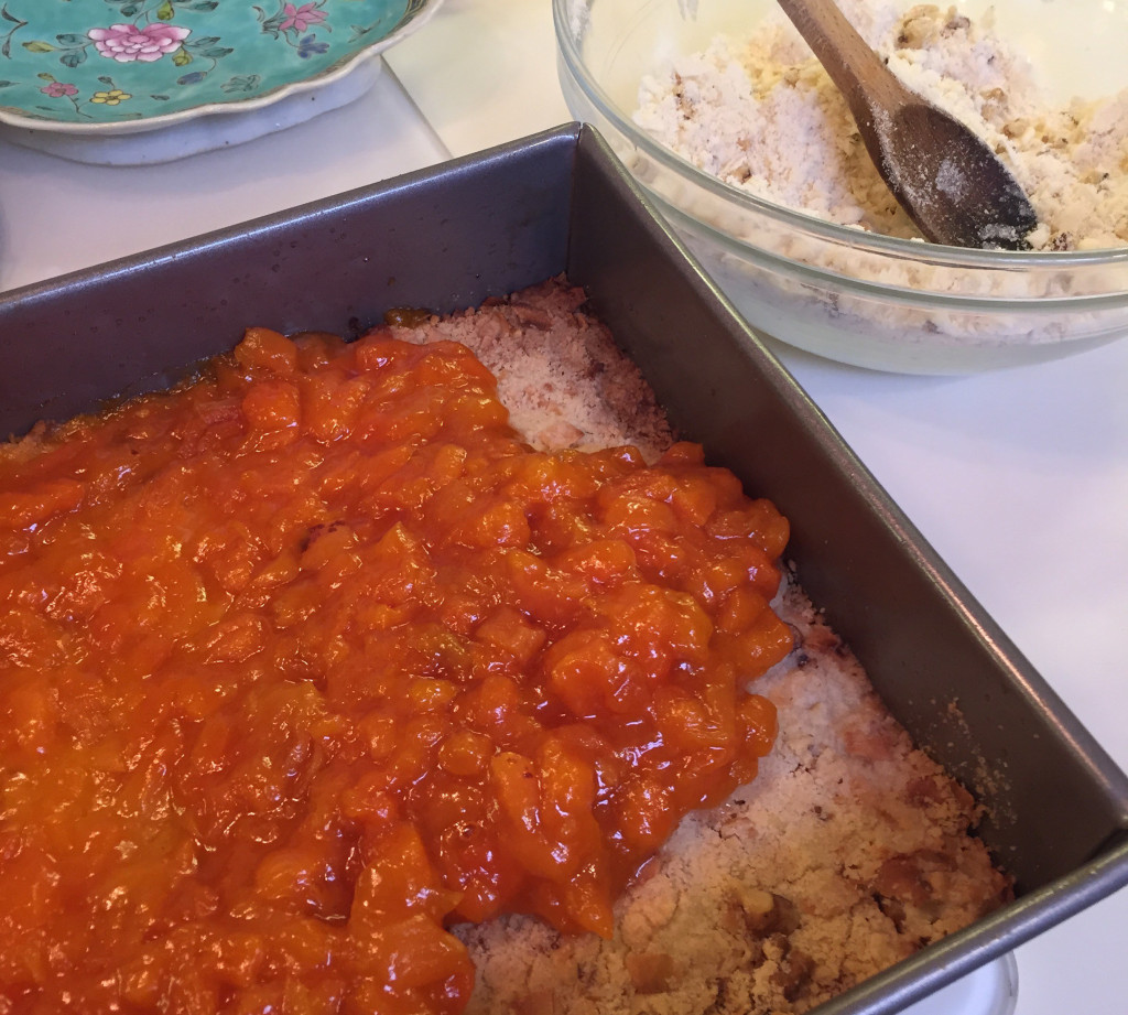 Spreading apricots on the cookie dough